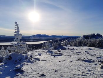 Scenic view of snowcapped mountains against sky during winter