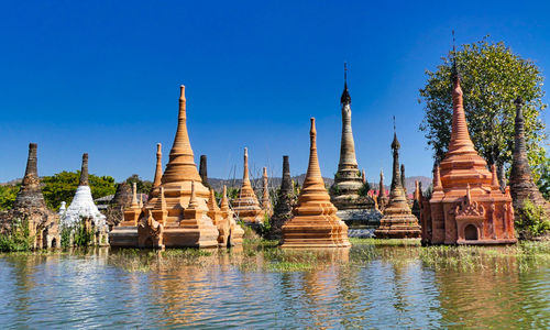 Panoramic view of temple against clear blue sky