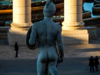 Rear view of statue in city