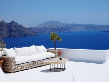 Sofa by sea on terrace at santorini