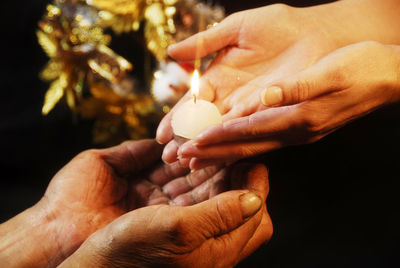 Close-up of man holding hands