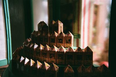 Close-up of food on glass window against building