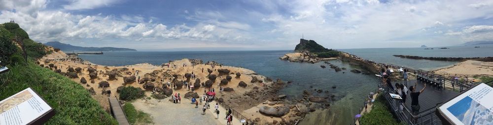 Panoramic view of people on beach