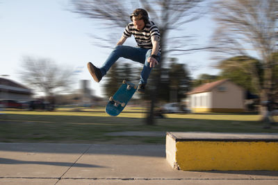 Full length of man skateboarding outdoors