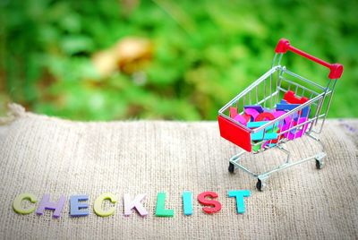 Colorful checklist text by shopping cart toy