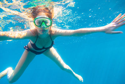 Portrait of woman swimming in sea