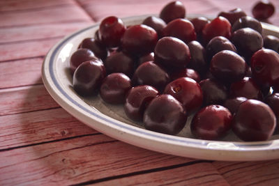 High angle view of raspberries in bowl on table