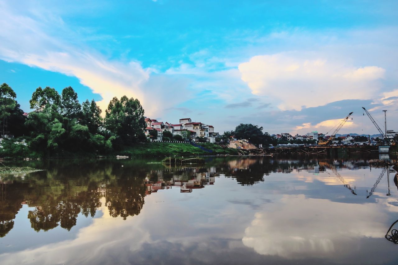 cloud - sky, sky, reflection, water, nature, outdoors, no people, scenics, tranquil scene, beauty in nature, lake, tree, building exterior, day, architecture