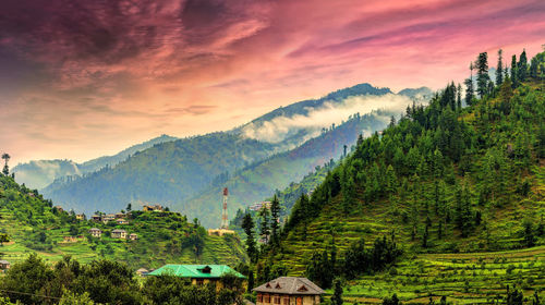 Scenic view of mountains against sky during sunset