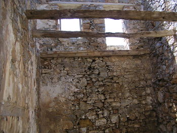 Low angle view of abandoned house