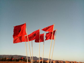 Close-up of flags against sky