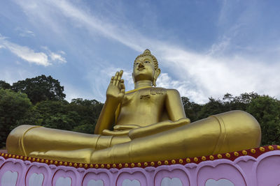 Low angle view of statue against sky