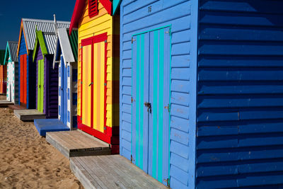 Multi colored buildings against blue sky