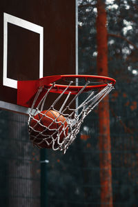 Close-up of basketball in hoop