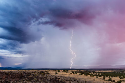 Lightning in sky over land