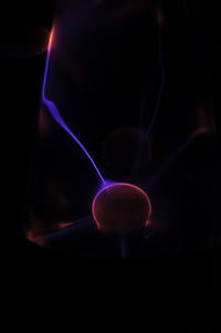 Close-up of light painting against black background