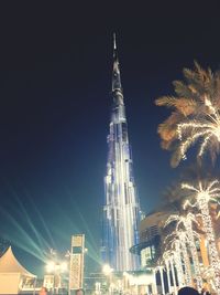 Low angle view of illuminated city at night