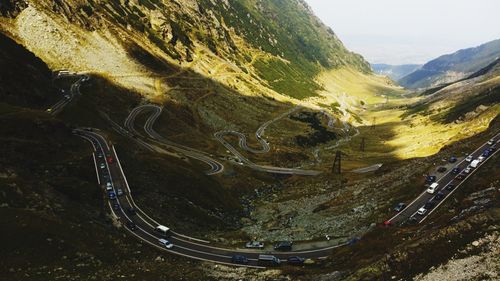 High angle view of road amidst mountains against sky