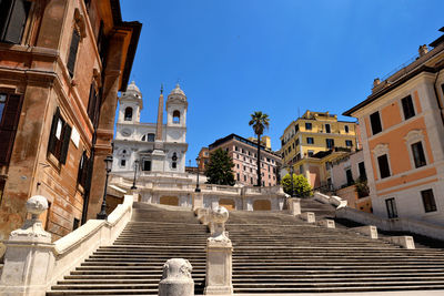 Historic building against blue sky in city