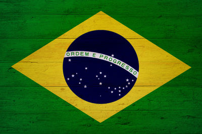 Close-up of arrow sign on road