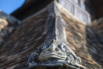 Close-up of statue against building