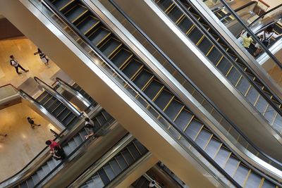 High angle view of people on escalator in building