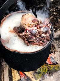 High angle view of meat on barbecue grill