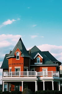 Buildings against cloudy sky