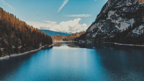 Scenic view of lake and mountains against sky