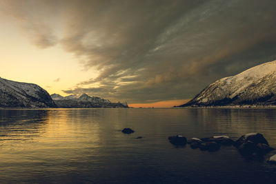 Scenic view of lake against sky during sunset