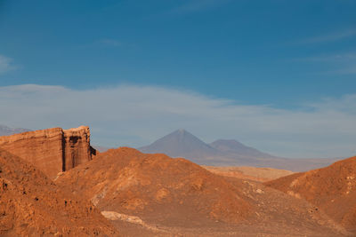 View of mountain range against cloudy sky