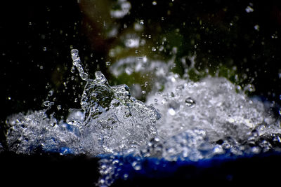 Close-up of splashing water against black background