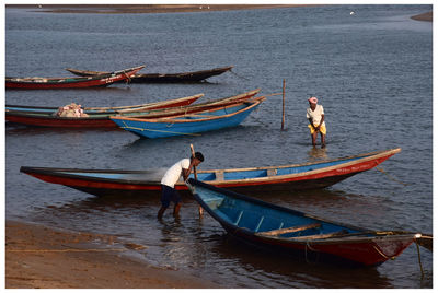 Boats moored in sea