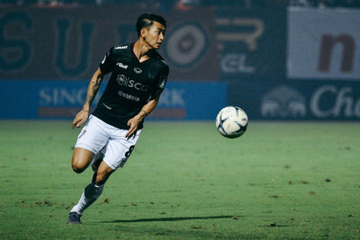 Man running on soccer field