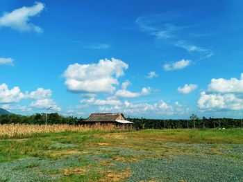 House on field against sky