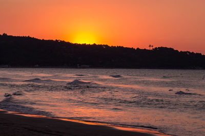 Scenic view of sea against sky during sunset