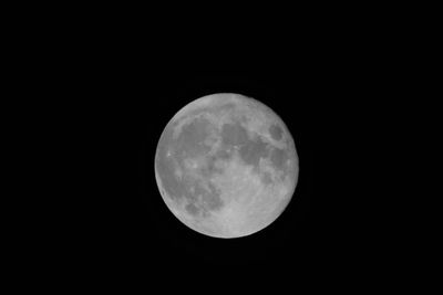 Low angle view of moon against clear sky at night