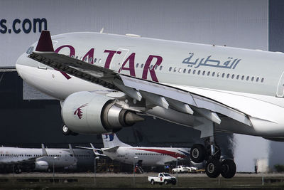 Close-up of airplane on airport runway