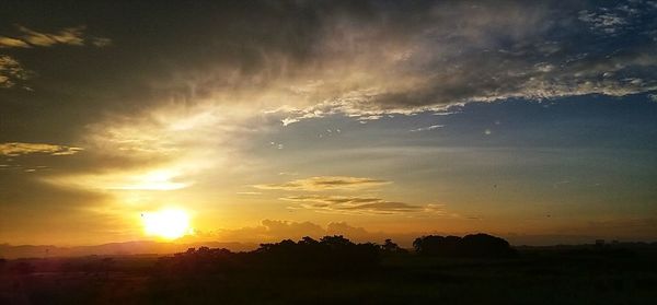 Scenic view of silhouette landscape against sky during sunset