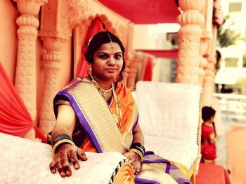 Portrait of beautiful young woman in temple