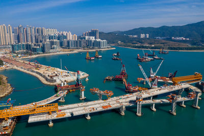 Aerial view of commercial dock against sky