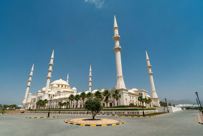 View of temple building against blue sky