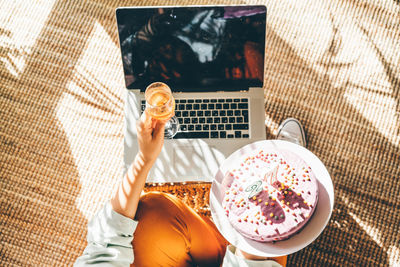 High angle view of man using laptop on table