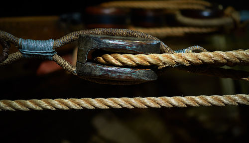 Close-up of rope tied on rusty metal