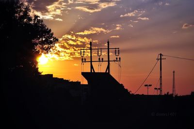 Silhouette of built structure at sunset