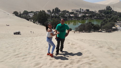 Young couple walking on beach