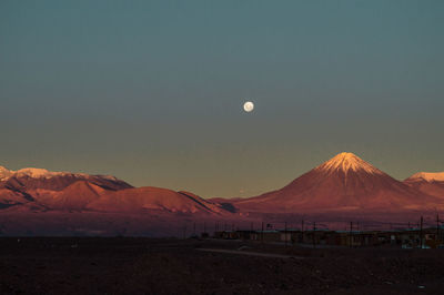 Scenic view of mountains against sky at sunset