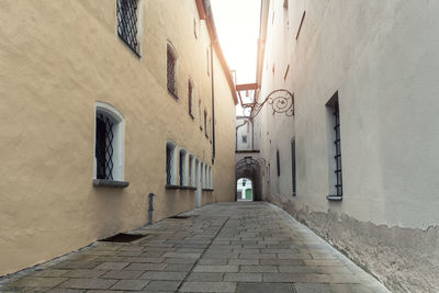 Empty alley amidst buildings