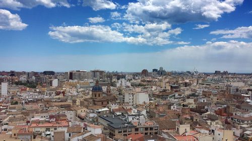 Town against cloudy sky