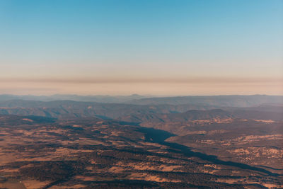 Aerial view of dramatic landscape against clear sky